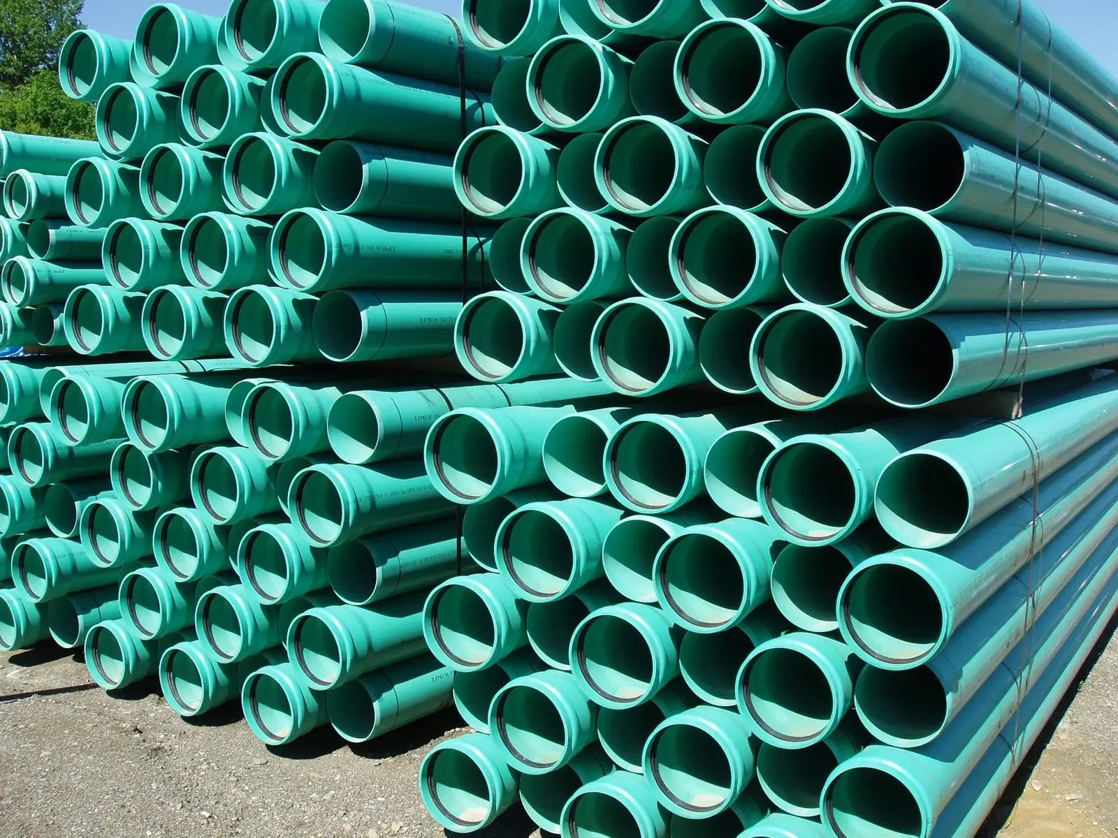 pile of plastics pipes made by plastic extrusion manufacturers