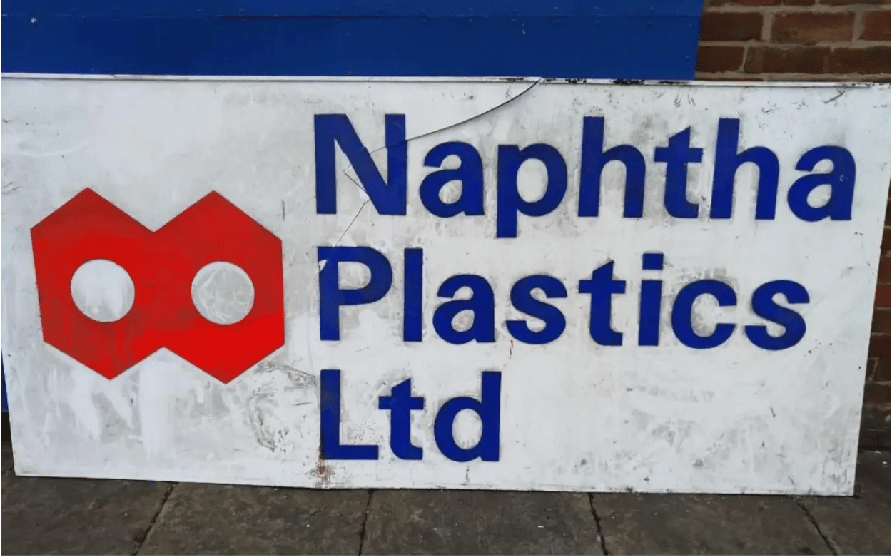 The original sign for Naphtha Plastics polymer suppliers uk